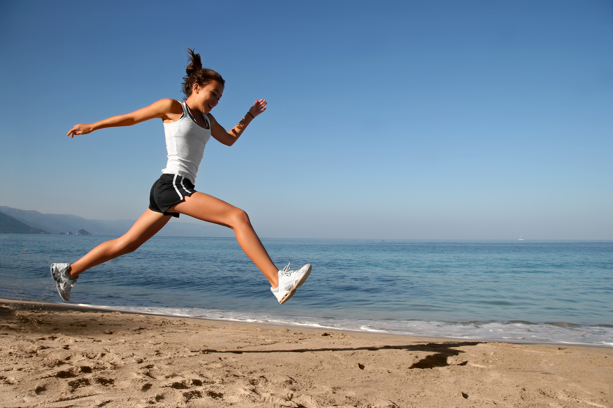 Woman-Running-on-Beach